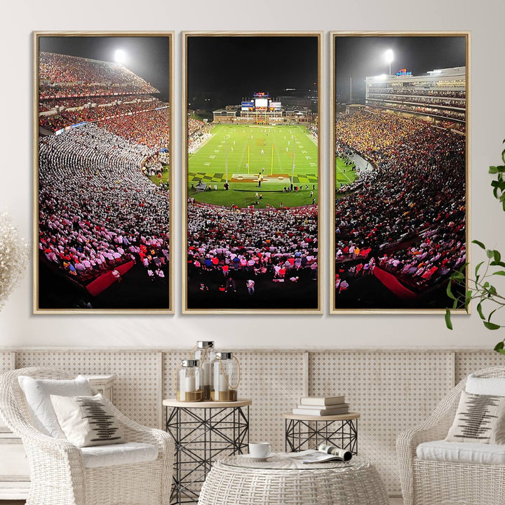 The Maryland Terrapins Football Wall Art Canvas showcases a packed SECU Stadium at night with a bright field and cheering fans.