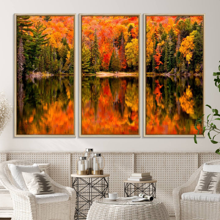 Autumn Forest Reflection Wall Art: a vibrant triptych canvas featuring fall foliage with red, orange, and yellow leaves over a calm lake.