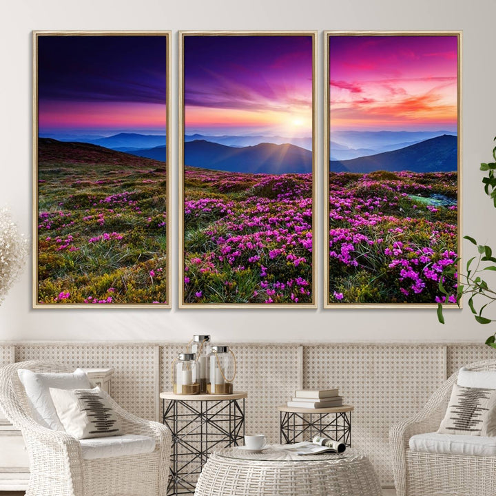 A 3-panel landscape photography canvas of a sunset over mountain meadows with purple wildflowers decorates the wall.