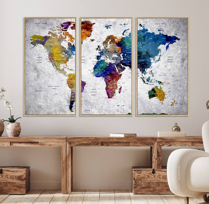 The World Map Art Canvas Print, featuring country names on a grunge-stained gray background, is perfect for stylish home decor.