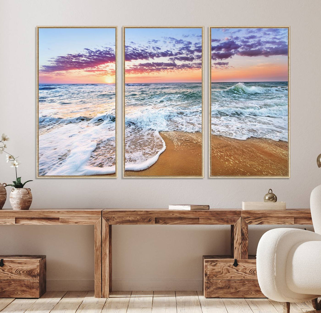 The Coastal Sunset Art Canvas Print features ocean waves beneath a vibrant sky in a stunning 3-panel seascape.