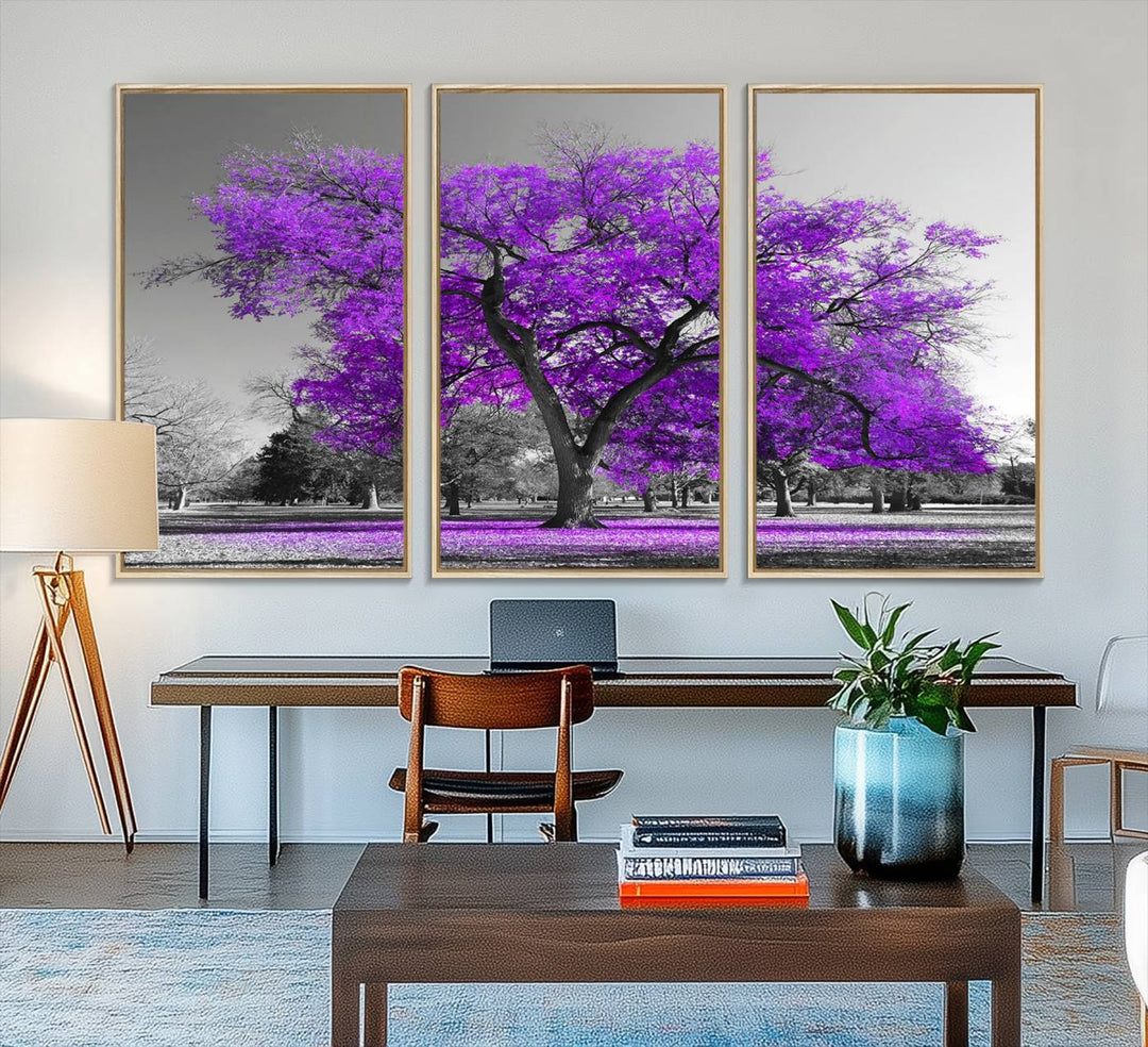 The Big Purple Tree Wall Art Canvas Print showcases a vibrant purple tree set against a black-and-white landscape.