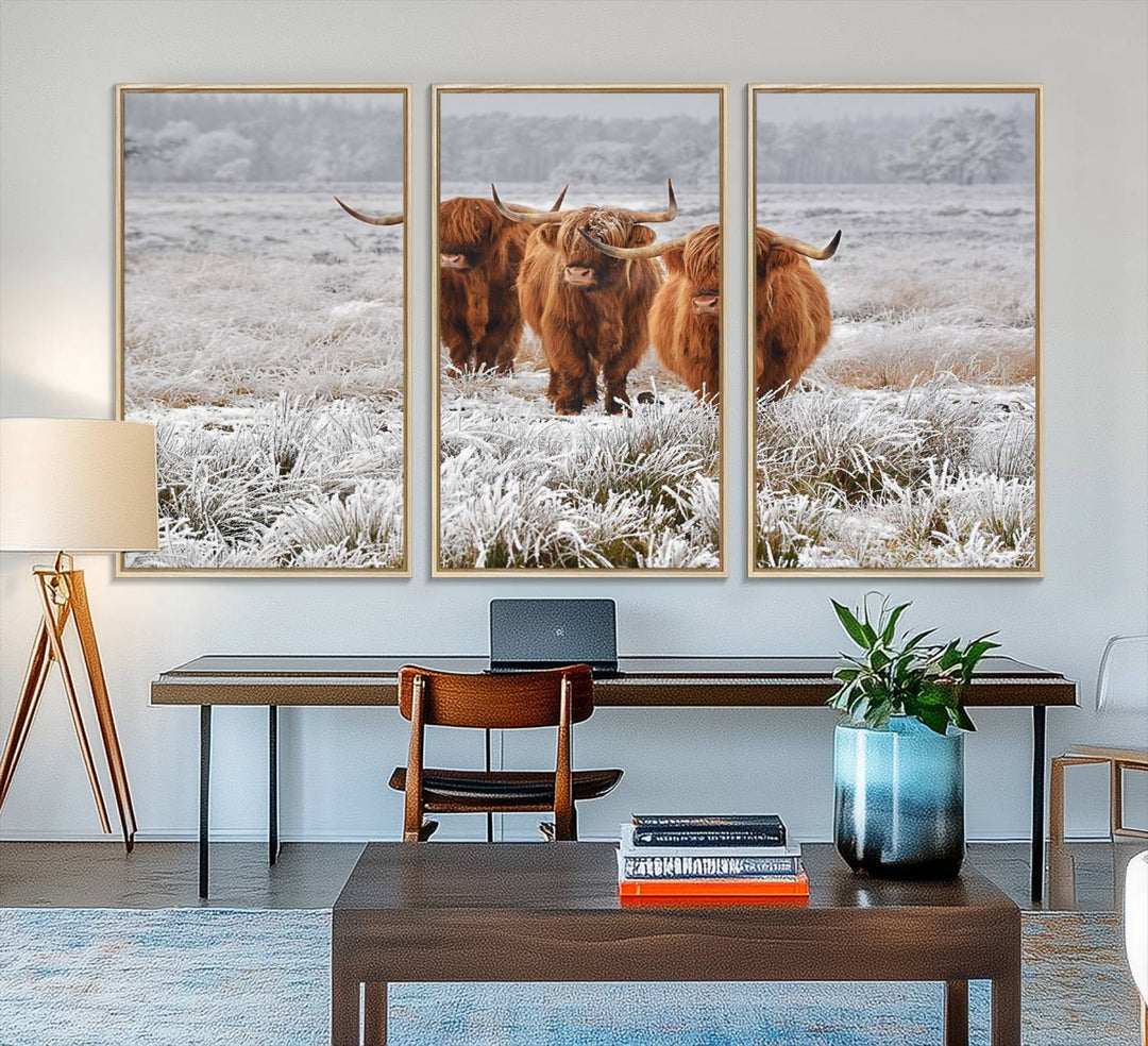 The Highland Cows in Snow canvas showcases three cattle in a frosty field.