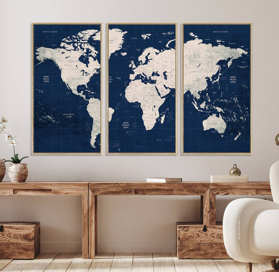 Large modern world map wall art canvas print in beige and navy; showcases a 3-panel vintage map design and is ready to hang.