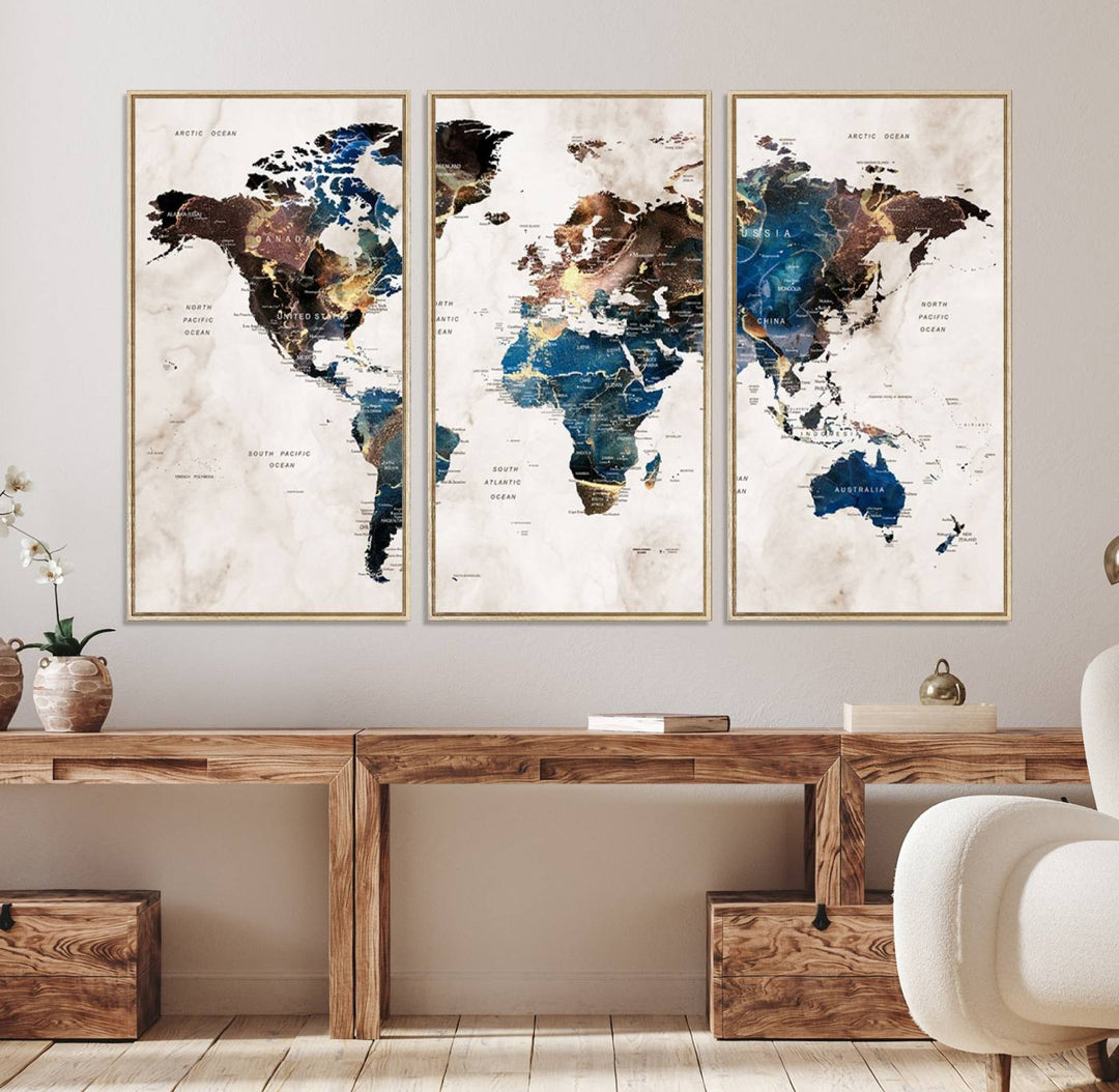 Abstract earth-toned 3-panel world map wall art featuring blues and browns, ready to hang; it showcases continents on modern canvas.