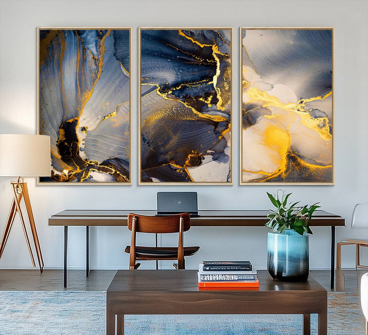A modern luxury kitchen features a large gold and blue abstract canvas wall art print.