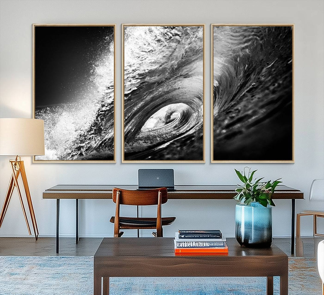 The Black Ocean Wave at Sunset Canvas Art hangs on a grey wooden wall.