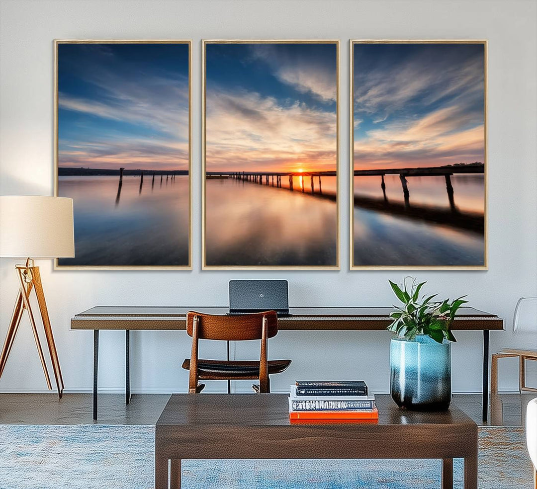 The Sunset Pier Canvas features a serene coastal landscape with vibrant hues under cloudy skies, ideal for modern decor.