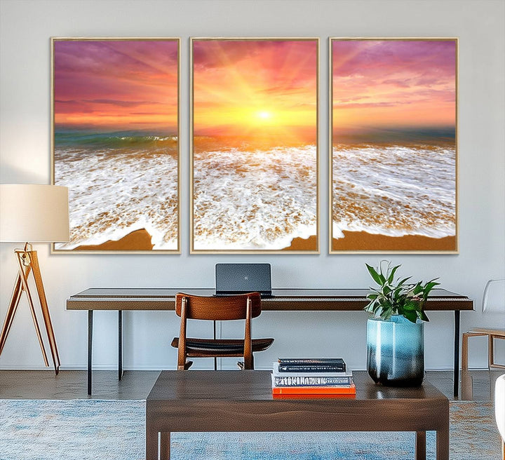 Golden Beach Sunrise 3-panel canvas art of ocean waves, hung on a wooden wall.