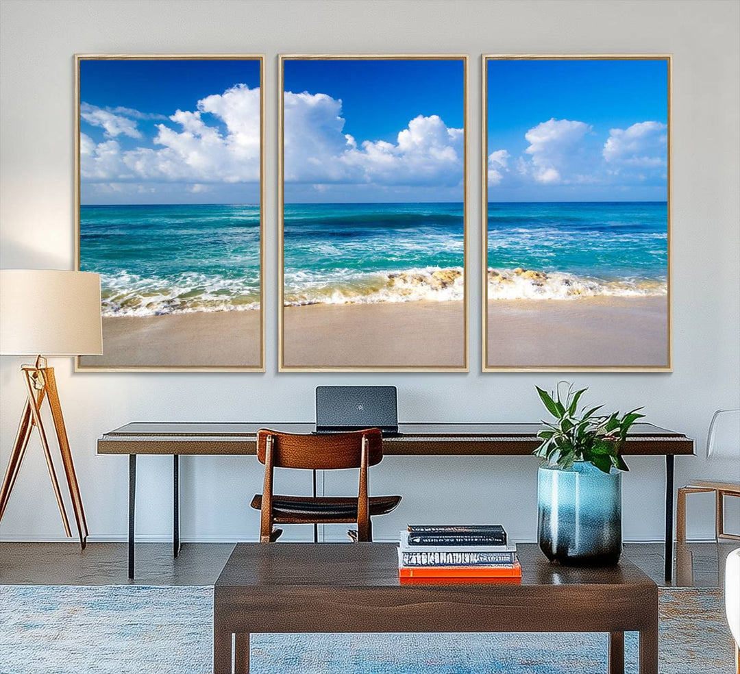 The Tropical Beach 3-Panel Canvas Wall Art features ocean waves gently lapping on a beach under blue skies, making it an ideal choice for coastal decor.