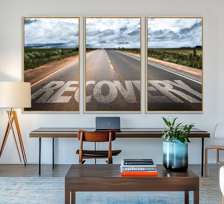 The Recovery Road Wall Art Canvas Print depicts a road under a cloudy horizon.