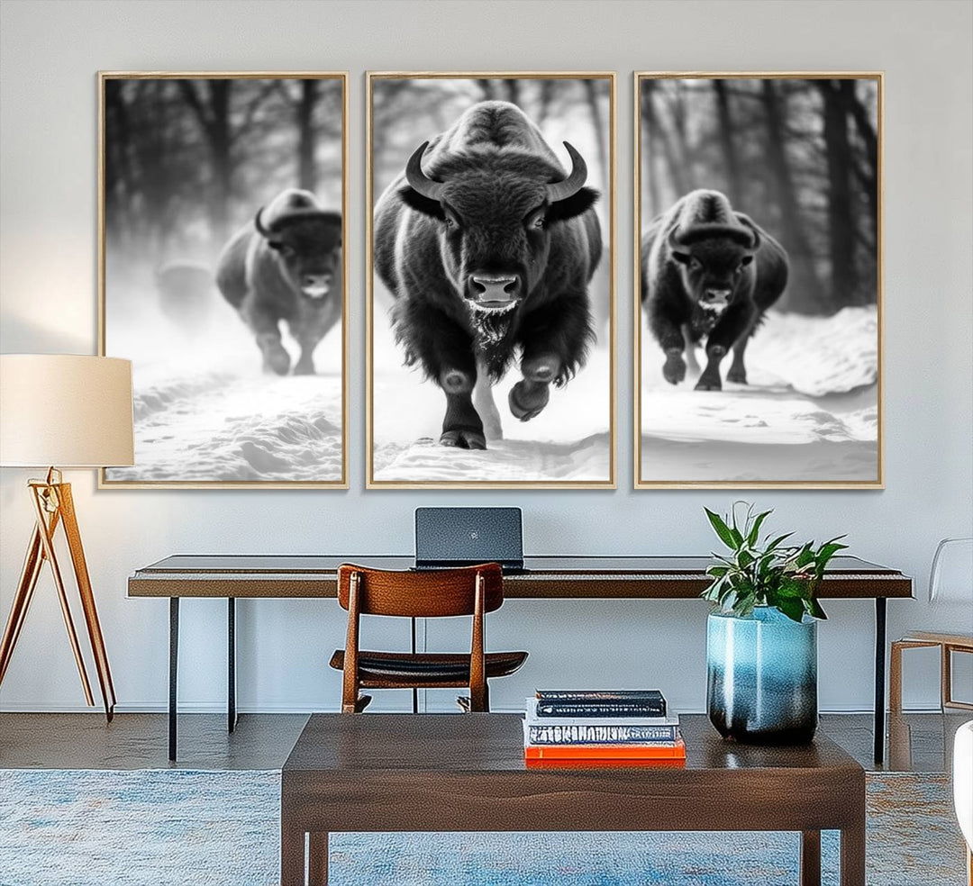 The Buffalo Wall Art Canvas Print of bison running through snow adorns the wall.