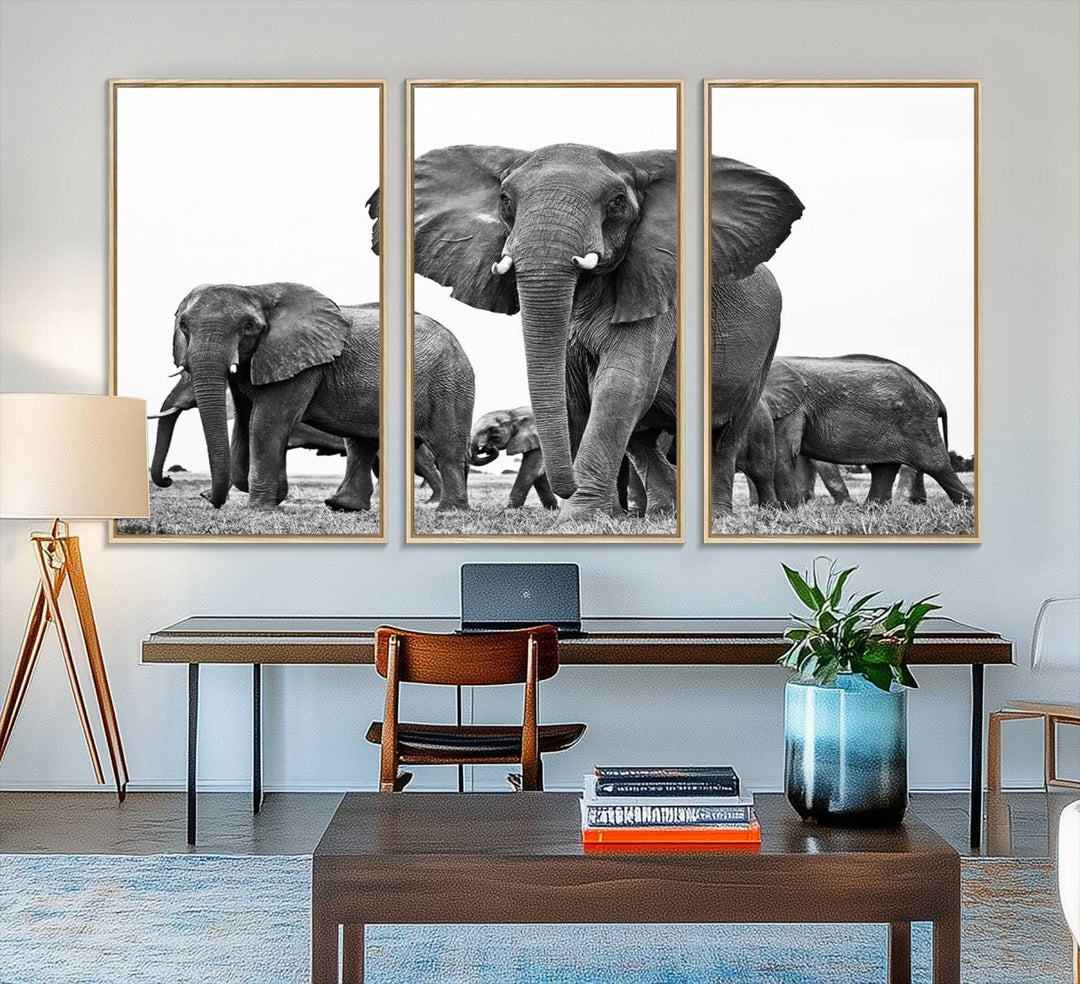 A modern dining area features a Black White Elephant Family Wall Art Canvas Print.