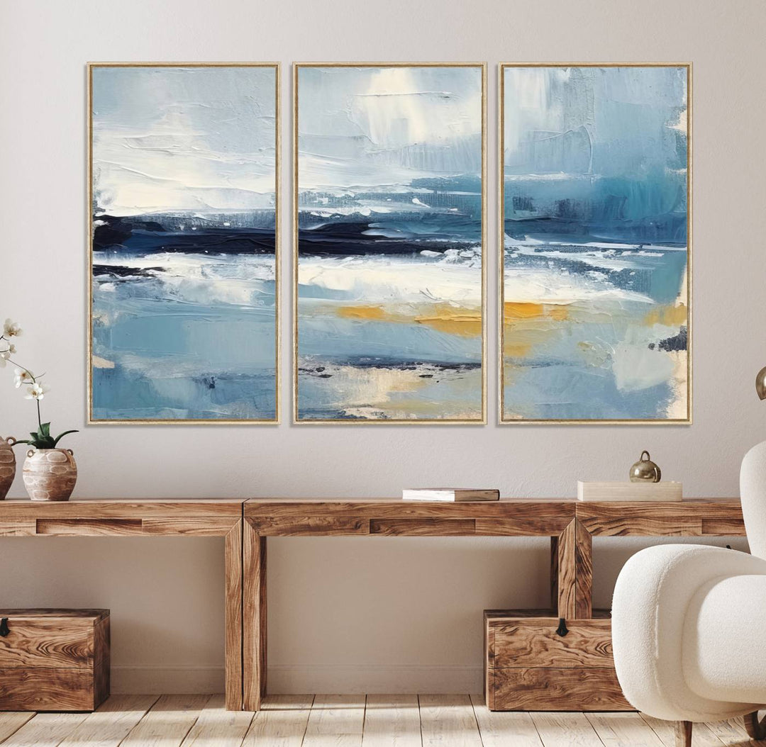 The Abstract Ocean Canvas Wall Art in coastal blue and gold enhances the modern kitchen.