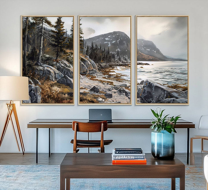 Framed wall art depicting Acadia National Parks rocky coast, trees, mountains, and sunlight over the sea; ready to hang.