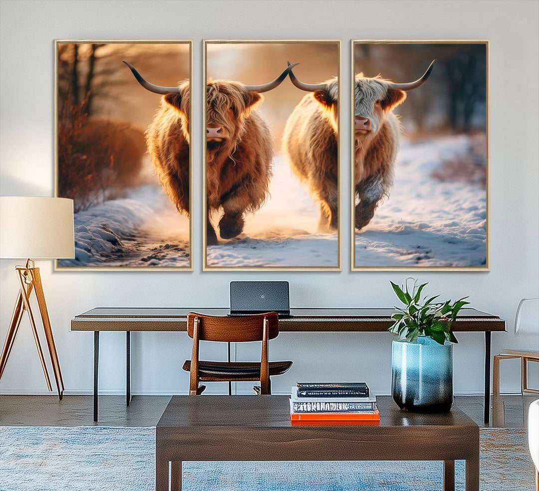 The wall art is a Scottish Highland Cow Horn canvas print featuring cows on a snowy path bathed in warm sunlight, serving as a rustic decor piece.