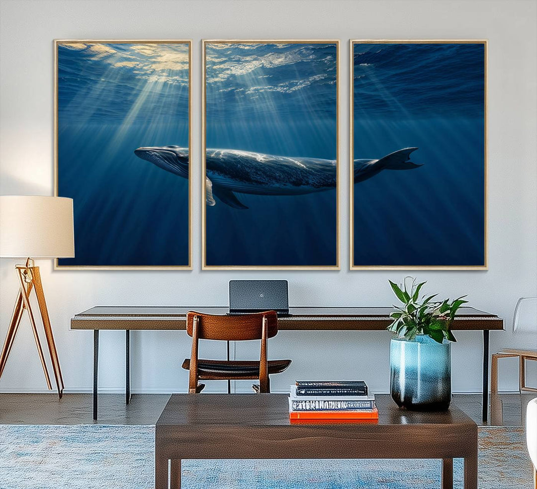 The Whale under Ocean wall art canvas print graces the white wall.