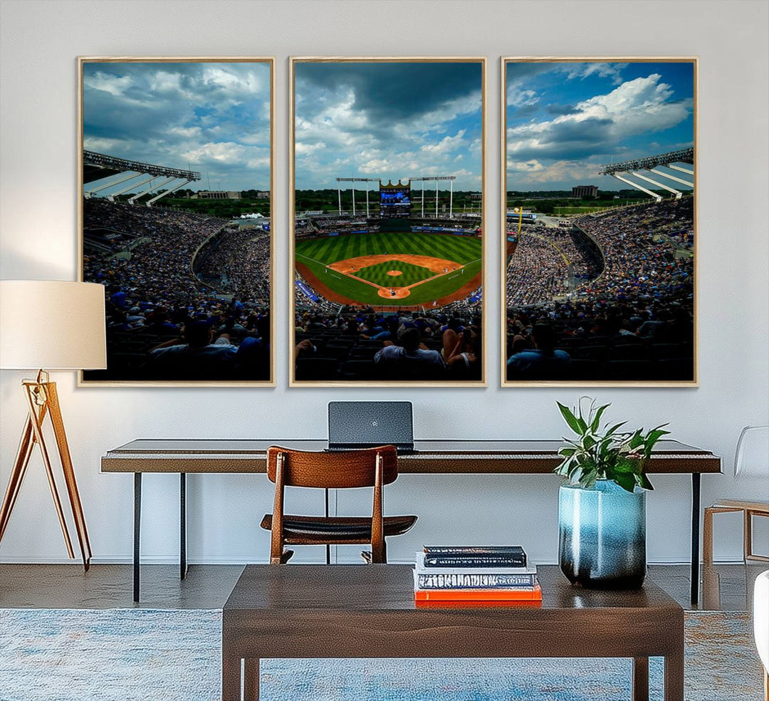 A 3-panel print of Kauffman Stadium, showcasing a crowded baseball field under cloudy skies.