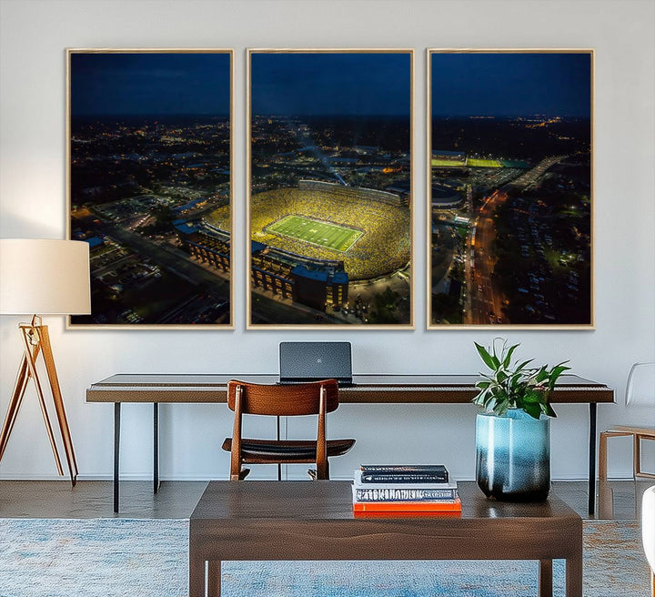 Aerial view of Michigan Stadium at night, surrounded by city lights, depicted on a Michigan Wolverines wall art canvas print.