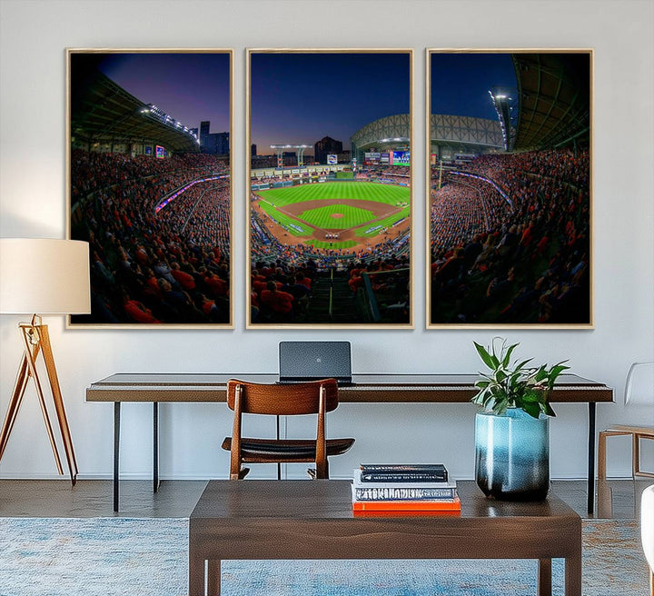 A canvas print of Houston Minute Maid Park at dusk is mounted on the wall.