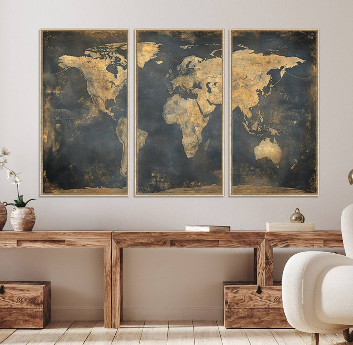 The Grunge World Map Canvas Wall Art features golden tones and is displayed against a white-paneled wall.