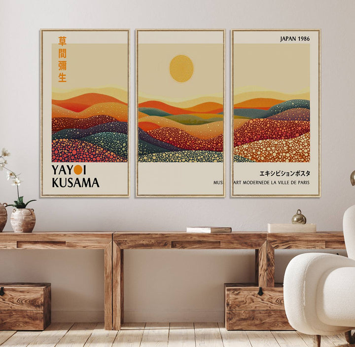 A Yayoi Kusama Wabi Sabi wall art print features abstract hills and a sun.