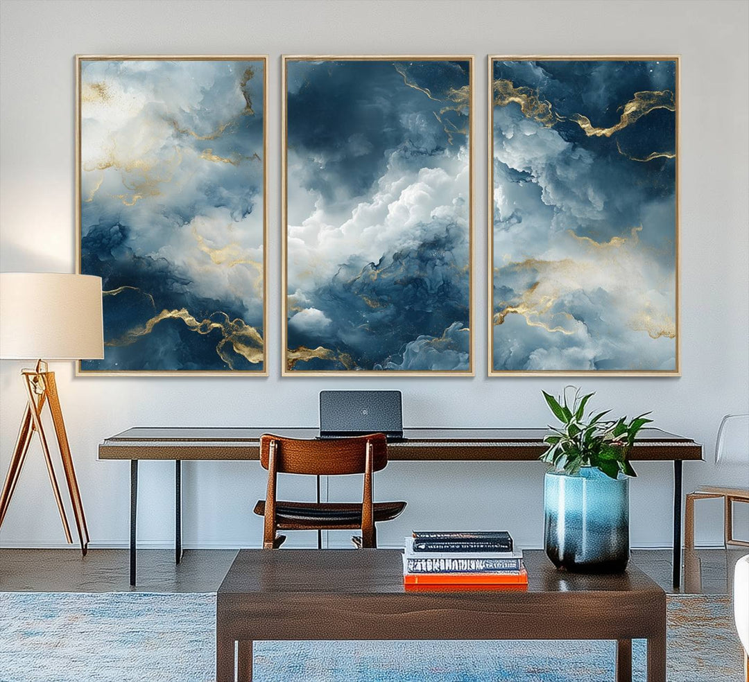 The "Large Abstract Print - Luxe Blue and Gold Abstract Canvas Wall Art" features a bold cloudscape design with swirling white patterns, ideal for modern home decor in living rooms or offices.