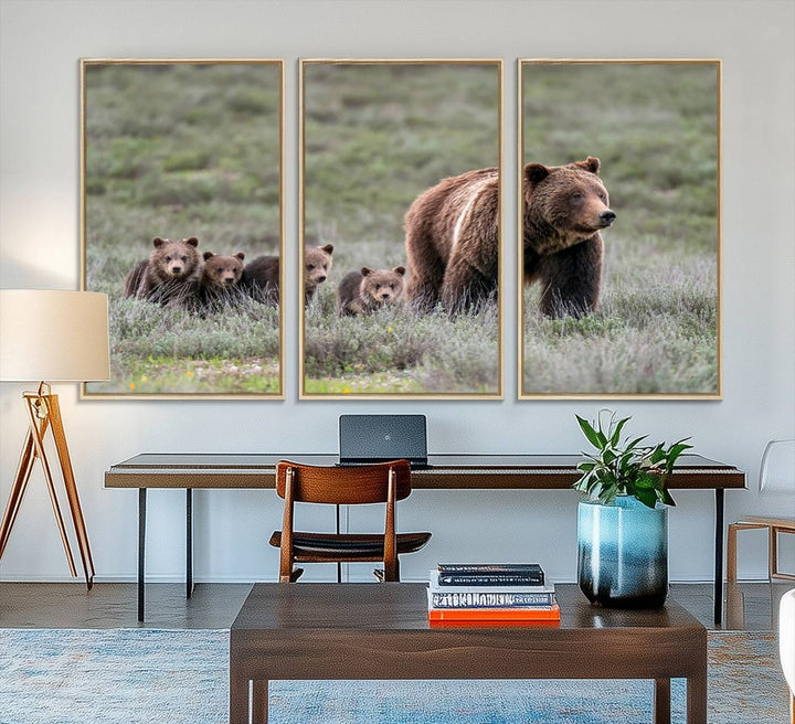 The large canvas print titled "Queen of the Tetons, 399 Grizzly Bear Cubs" showcases majestic wildlife photography of a bear and her cubs walking through the grass. This stunning canvas wall art, handmade in the USA, adds a charming touch to any room with its rustic decor appeal.