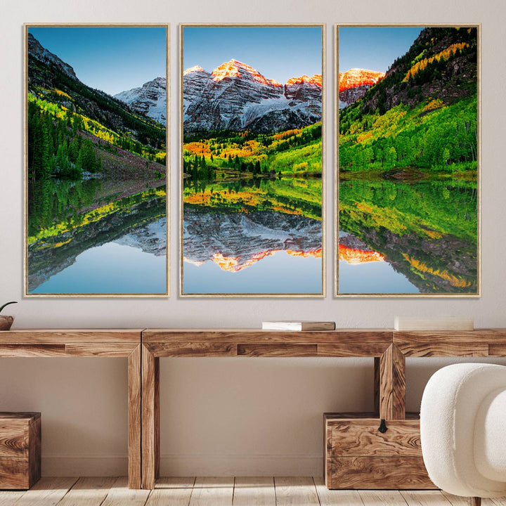 The Sunrise Maroon Bells Lake Wall Art Print beautifully captures North Maroon Peak mirrored in the tranquil lake, framed by lush greenery.