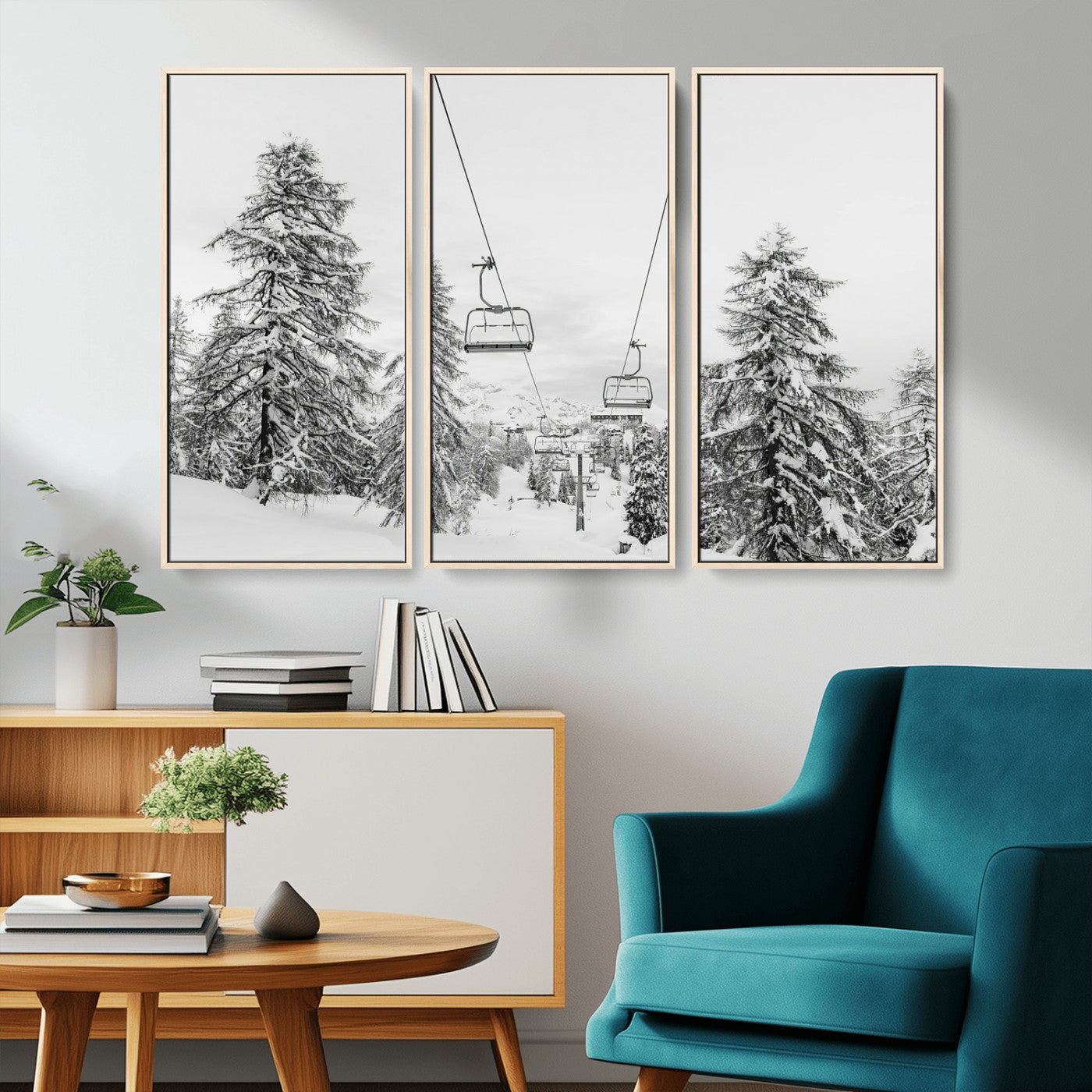 Black and white image of a ski lift amidst snow-covered pine trees, ideal for winter mountain or cabin-themed decor.