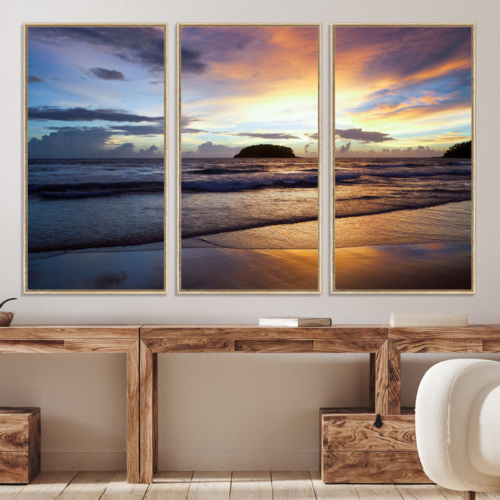A tropical beach at sunset with waves gently washing ashore, reflecting golden and purple hues in the sky, creating a tranquil coastal scene.