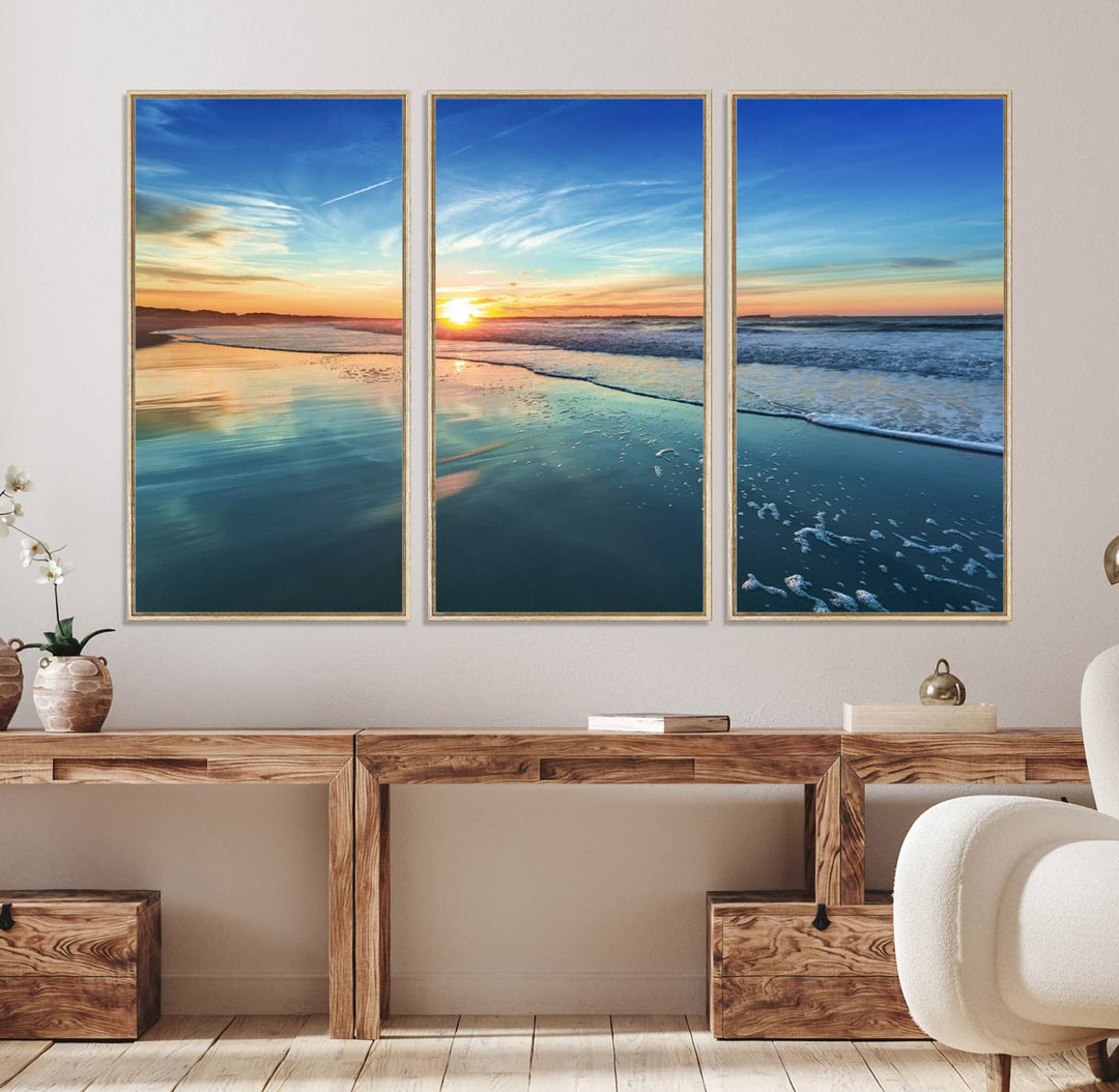 The Blue Sky and Beach Wall Art Canvas Print features a vibrant orange sky reflecting on wet sand.