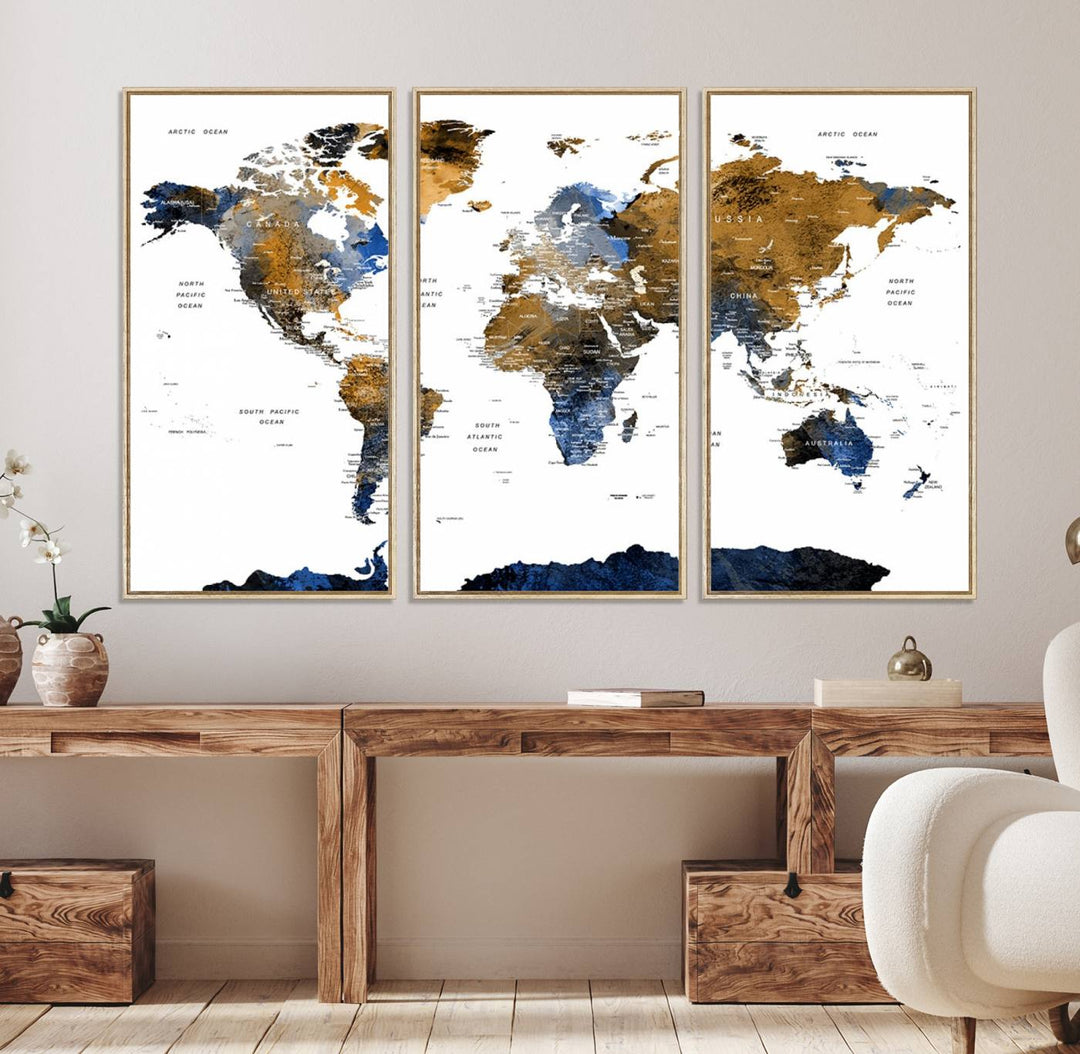 The Triptych Modern World Map Canvas in blue and brown is an ideal global decor piece for enhancing living rooms or offices. It comes ready to hang.