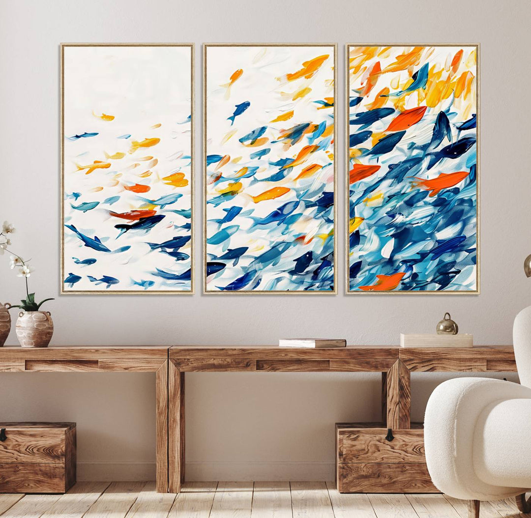 A colorful Abstract Fish Shoal Canvas Print hangs on the wall.