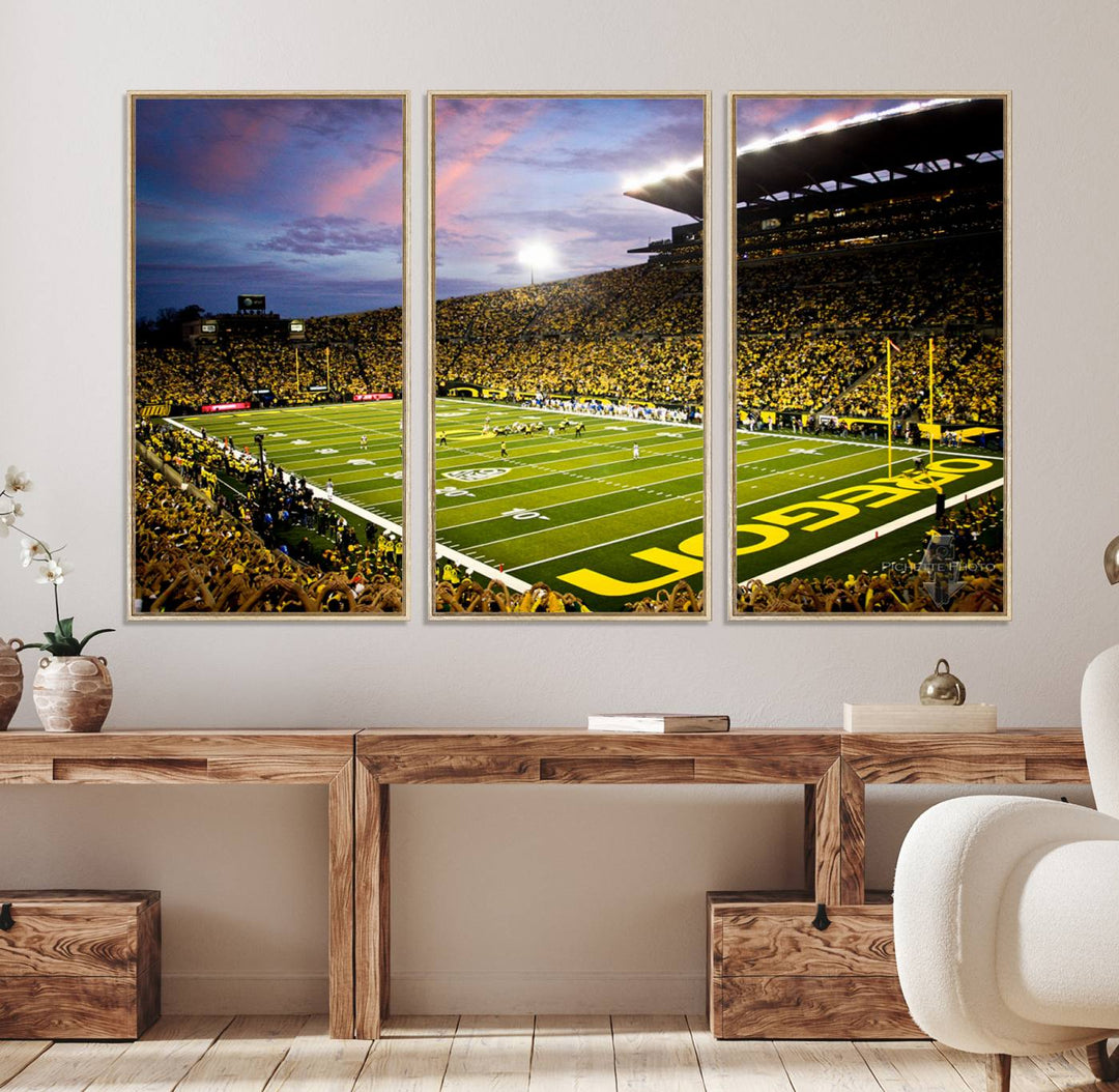 This gallery-quality canvas print features a depiction of the OREGON field filled with fans at sunset, capturing the essence of the University of Oregon Ducks Autzen Stadium.