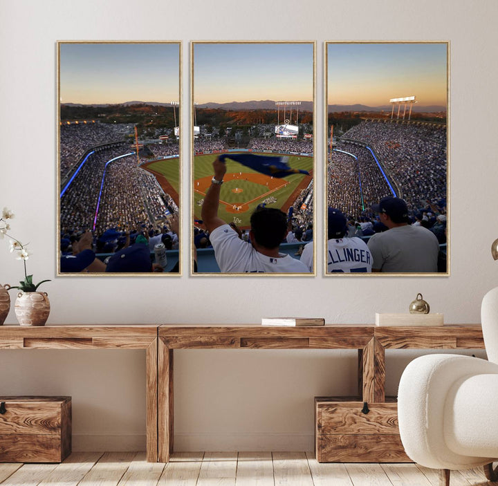 A triple canvas wall art captures the scene at Dodger Stadium, with fans cheering as the sun sets and a flag waving on the field.