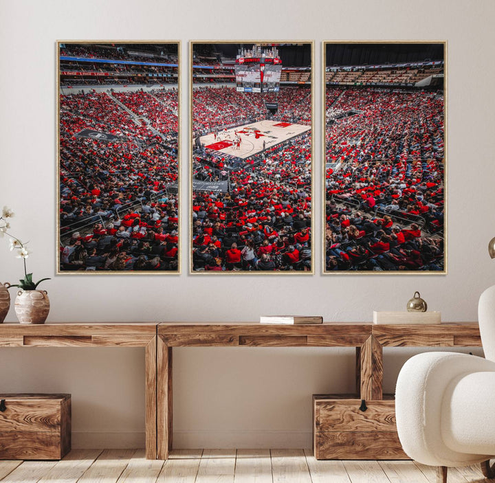 A painting of Louisville Cardinals fans in red at the KFC Yum Center Arena.