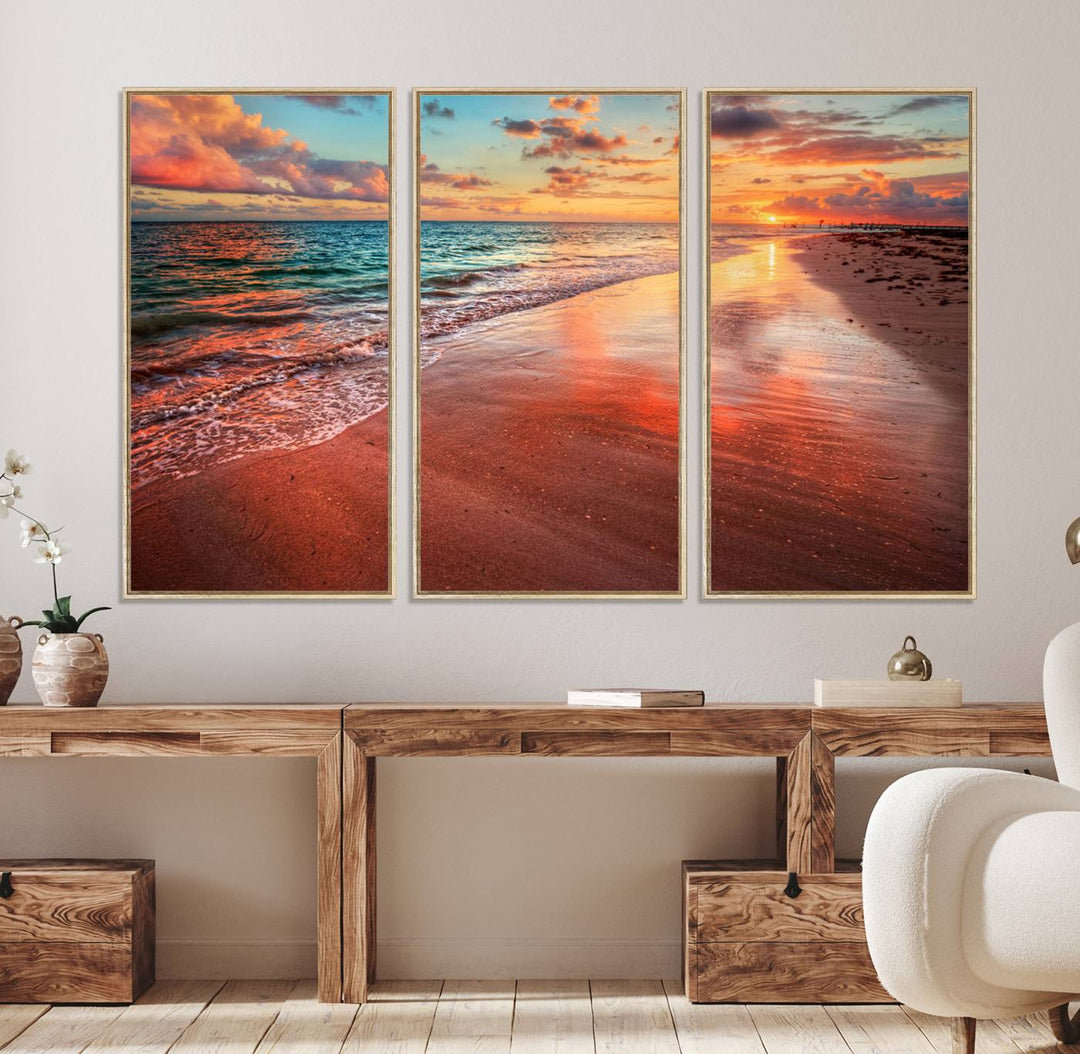 An Ocean Canvas Print depicts a sunset over a beach with reflections.