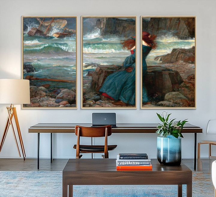 The Miranda by the Shore Wall Art Canvas Print depicts a woman in a blue dress standing by the sea, watching a shipwreck.