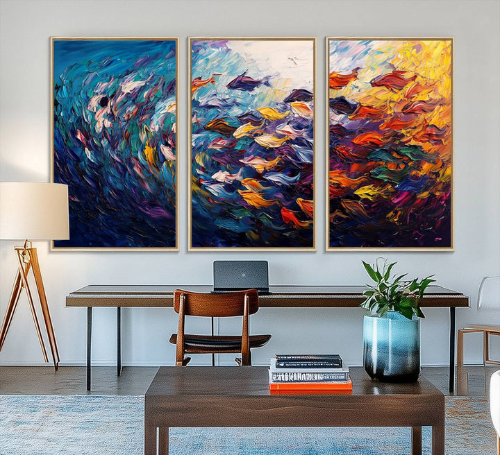 The Vibrant Abstract Fish Swarm Art features a colorful 3-piece canvas that adds a pop of color.