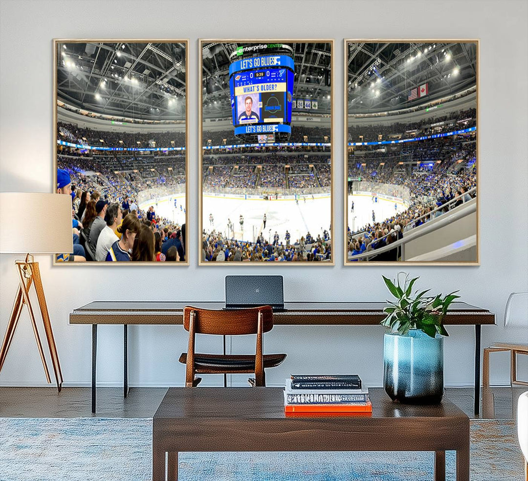 Wall art prints depicting the bustling scenes of the St. Louis Blues being cheered on by a full house at the Enterprise Center, beneath a large scoreboard.