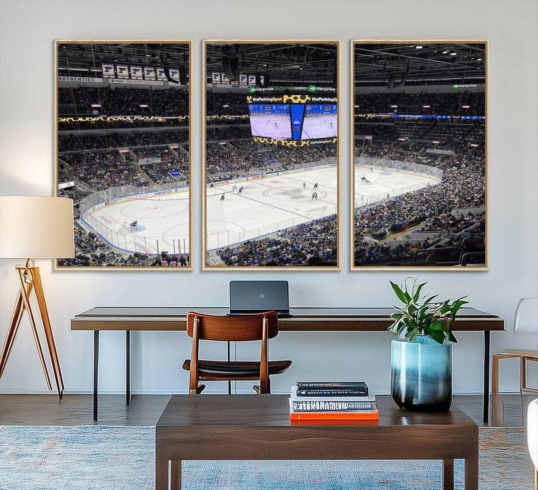 A large Enterprise Center canvas of a crowded hockey arena hangs prominently.