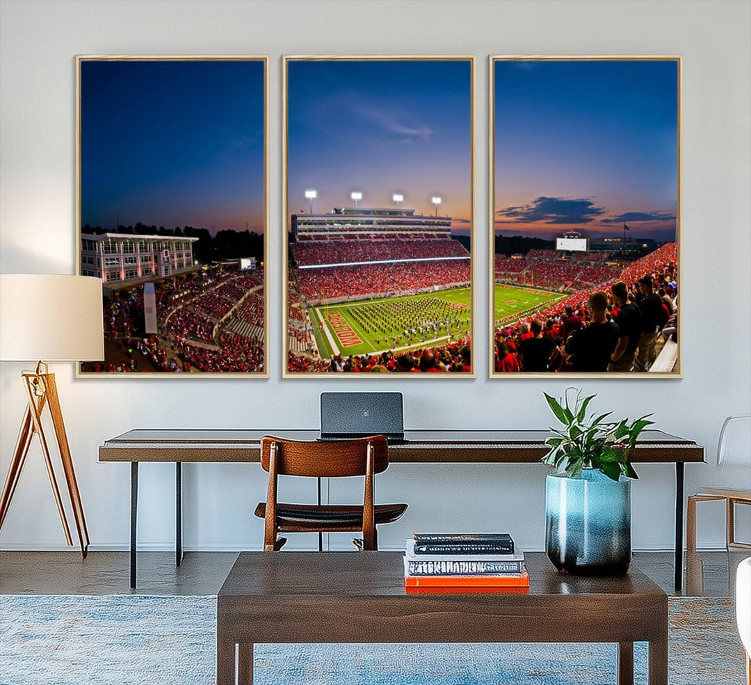 A vibrant and dynamic painting captures the essence of an electrifying night game at Carter-Finley Stadium, highlighting the illuminated atmosphere as the NC State Wolfpack competes under bright stadium lights.