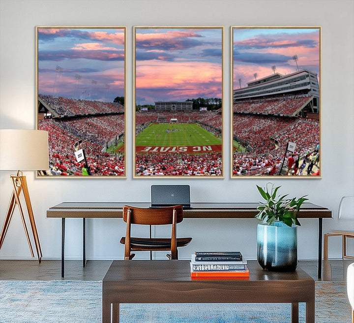 The wall art captures an NC State Wolfpack game under a vibrant sunset on triple canvas.