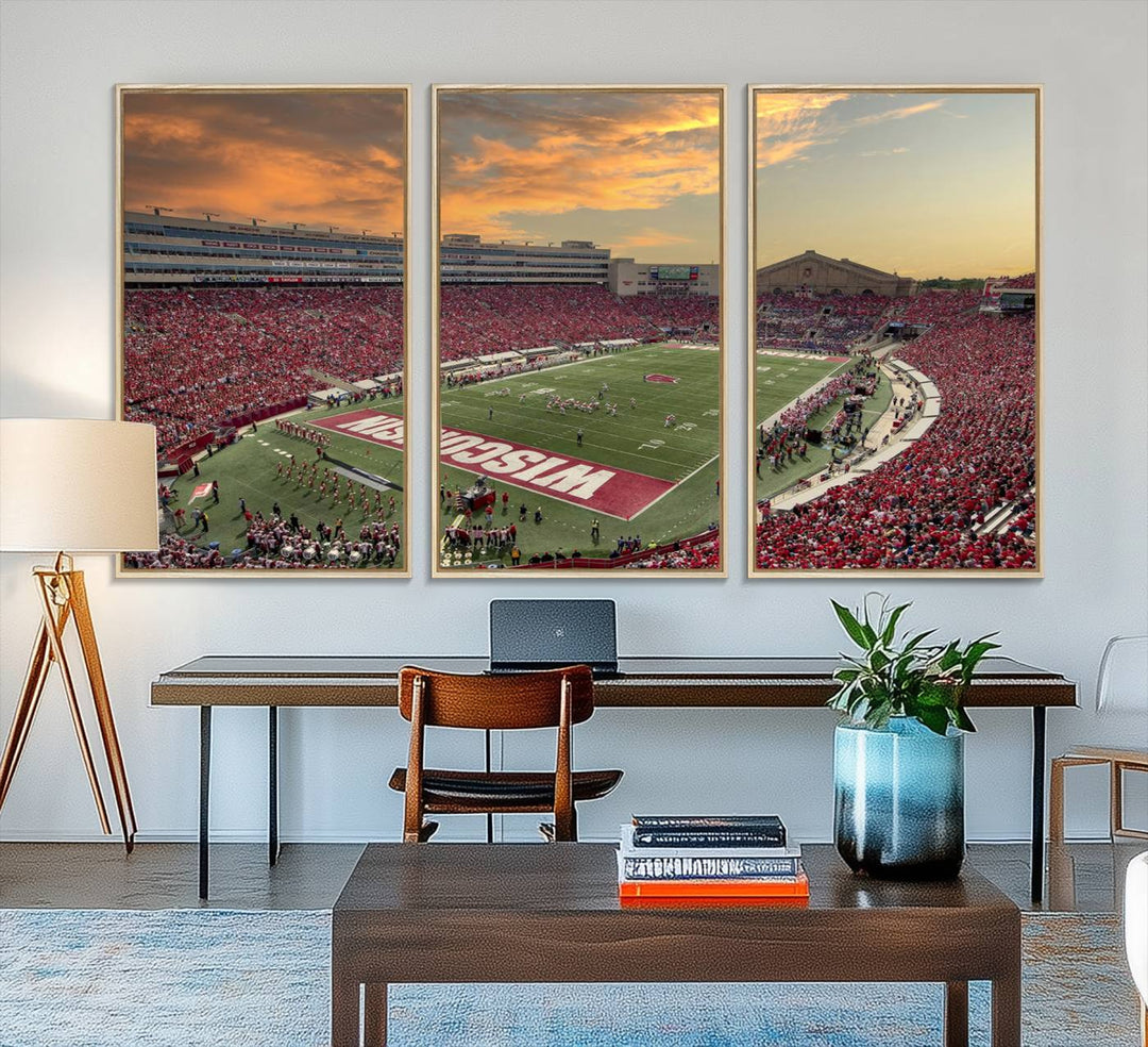 The wall features a Wisconsin Badgers wall art canvas print, capturing the vibrant atmosphere of a full Camp Randall Stadium at sunset.