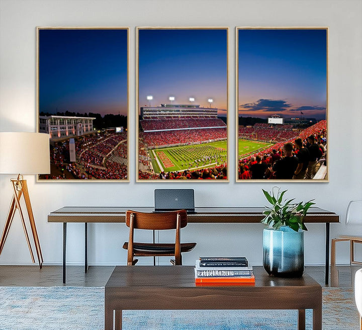 The Wolfpack Football Team Print captures a band and crowd at dusk in a premium canvas art style at Raleigh Carter-Finley Stadium.