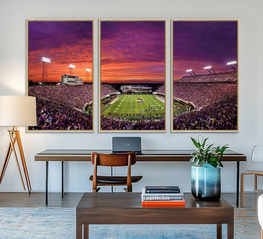 A sunset over Dowdy-Ficklen Stadium, Greenville, captured on museum quality canvas with vibrant purple and orange skies.