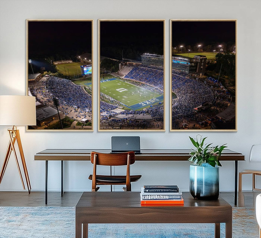 Night aerial view of packed Duke Blue Devils Wallace Wade Stadium, surrounded by trees and illuminated by lights; perfect for high-resolution prints.