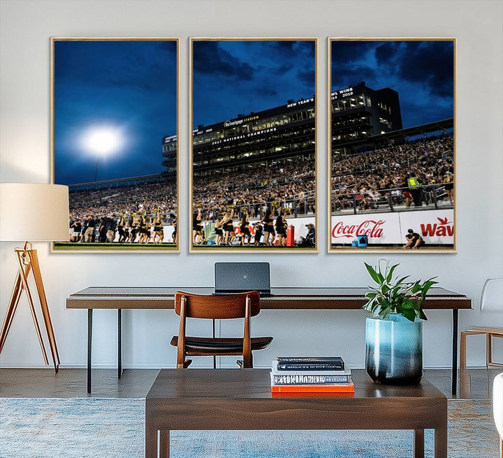 A gallery-quality canvas print depicting a stadium packed with fans under a night sky, highlighting the UCF Knights Football Team.