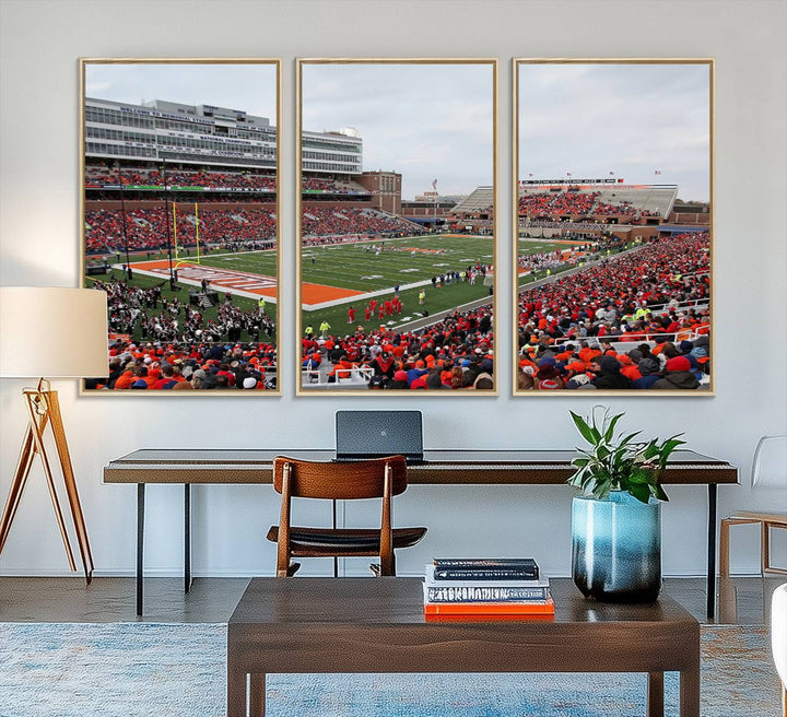 A University of Illinois Fighting Illini wall art canvas hangs on the wall, depicting a packed stadium.